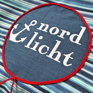 Rundes Hundebett Hundekissen rund gestreift in Blautönen und Applikation Nordlicht und Anker in Weiß für mittelgroße Hunde